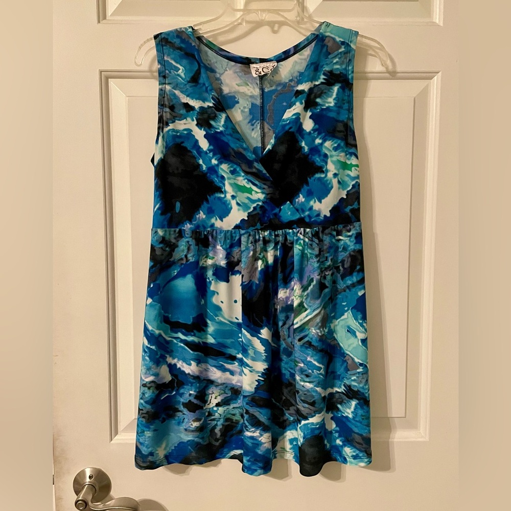 Sleeveless blue crossover empire waist shirt by VKY&CO, size medium